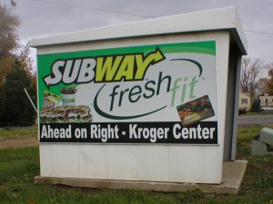 A restaurant ad on a bus shelter